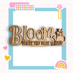 a wooden sign that says bloom where you were planted