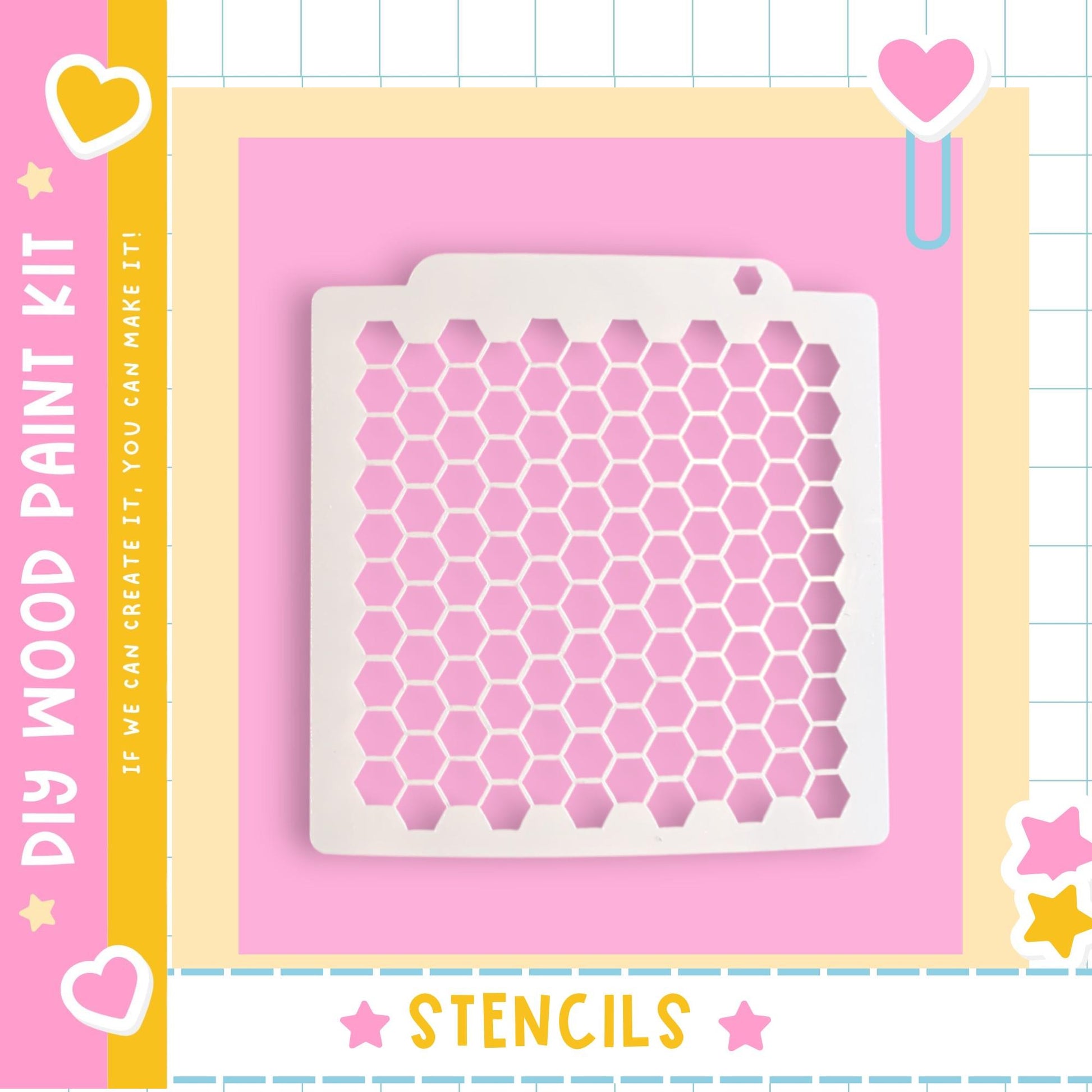 a DIY paint kit with a pink background and a white hexagonal stencil.