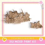 a DIY wood paint kit, with a focus on butterflies and flowers. The kit includes a wooden frame with various butterfly and flower designs, as well as a smaller wooden butterfly and flower piece. The kit is presented in a pink and yellow frame, and the text encourages creativity and the ability to make the kit.