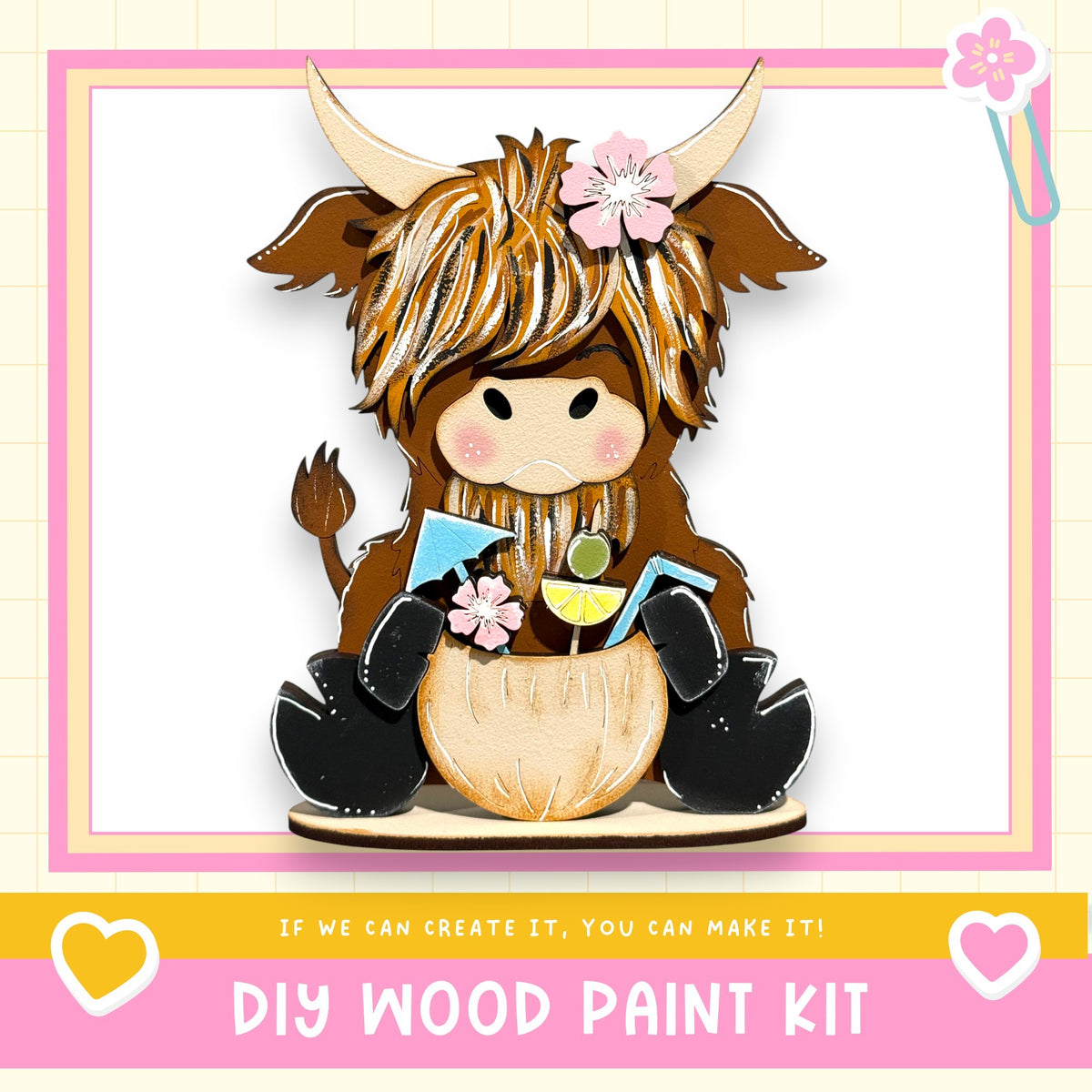 A wooden toy cow with horns and a flower in its hair, sitting on a wooden base and holding a small toy figure.