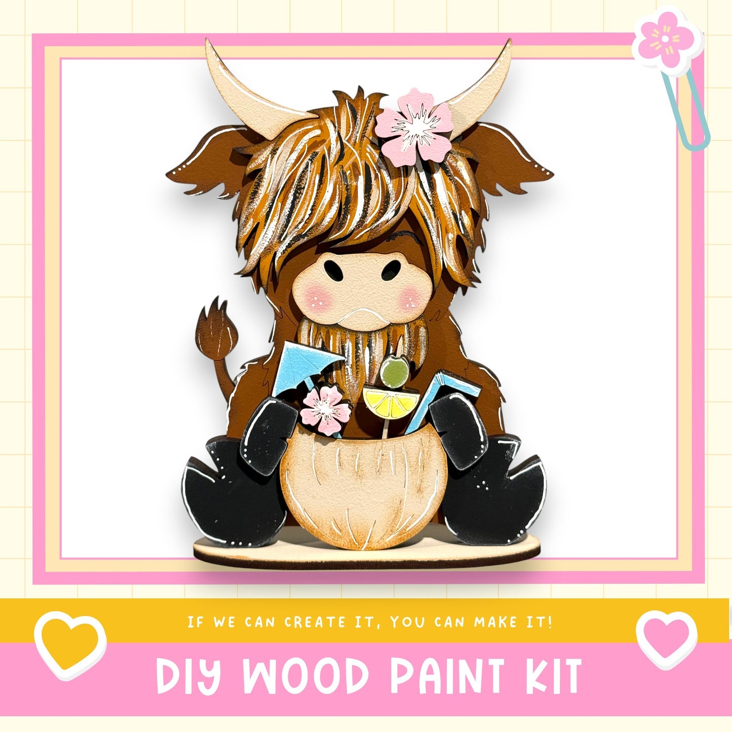 A wooden toy cow with horns and a flower in its hair, sitting on a wooden base and holding a small toy figure.
