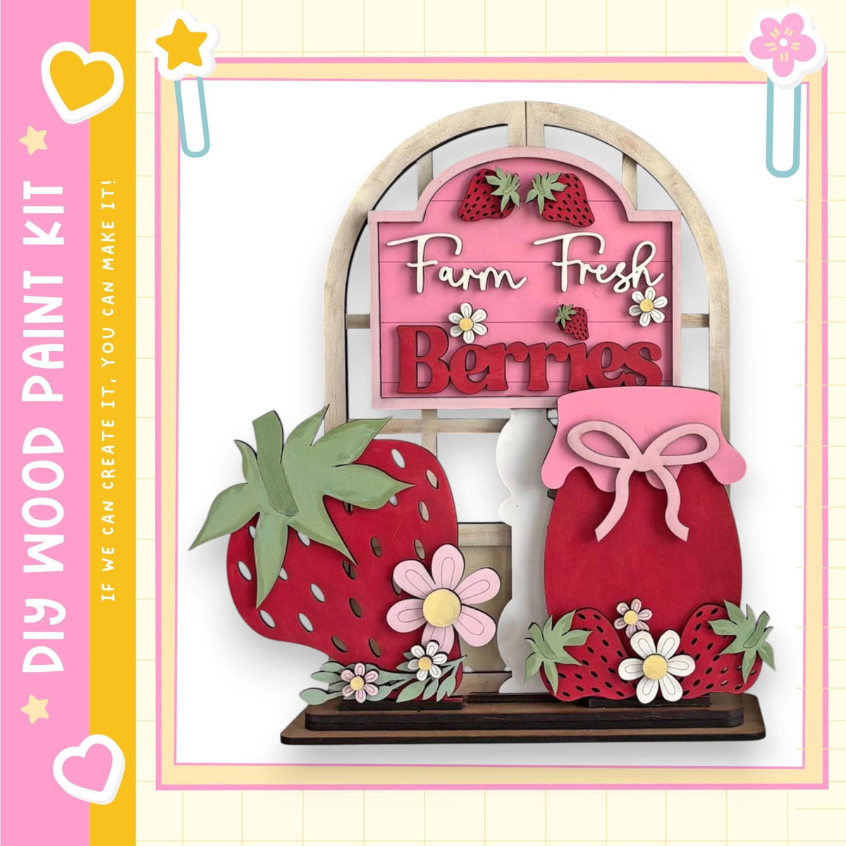 a wooden sign with the words "Farm Fresh Berries" written on it, surrounded by various cut-out shapes resembling strawberries and flowers.