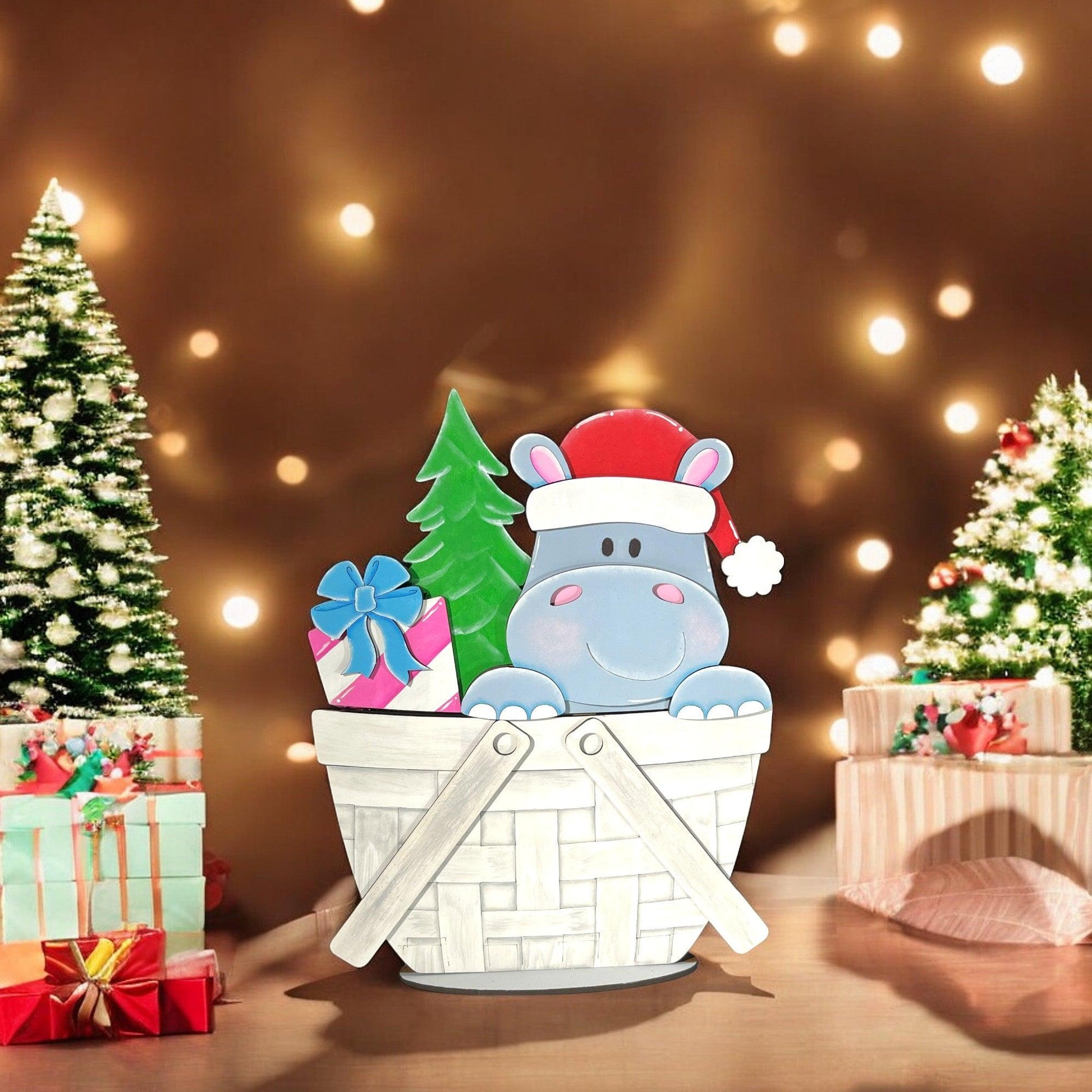 a christmas scene with presents and a hippo in a basket