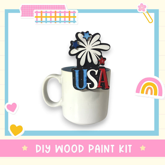 A white mug with a colorful design on it, surrounded by various decorative elements such as hearts, stars, and a rainbow.