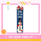 a DIY wood paint kit for creating a snowman, with a snowman decoration and a bow on a blue sign.