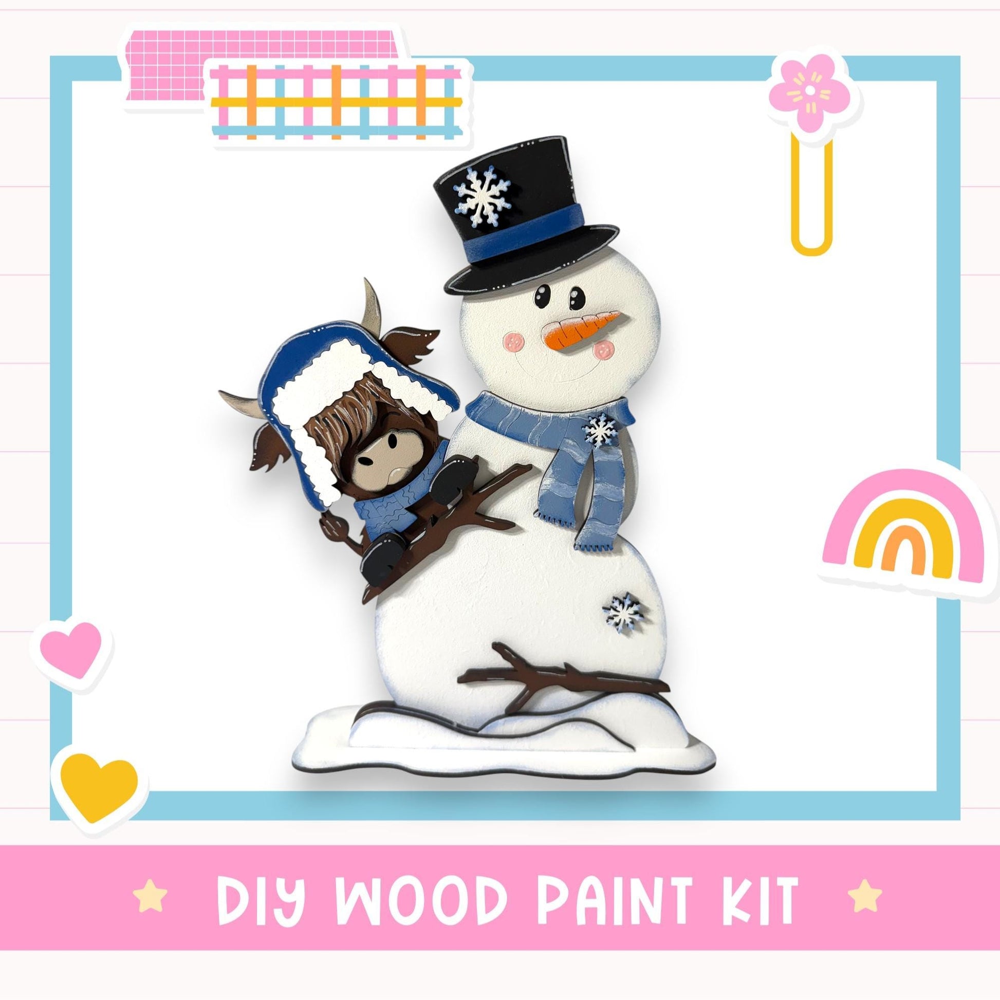 A snowman and a cow figure are depicted in a DIY wood paint kit, surrounded by various colorful stickers and a heart shape.