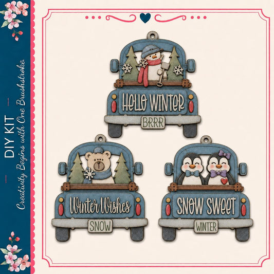 three decorative truck ornaments with winter-themed designs, including a snowman, a bear, and two penguins.