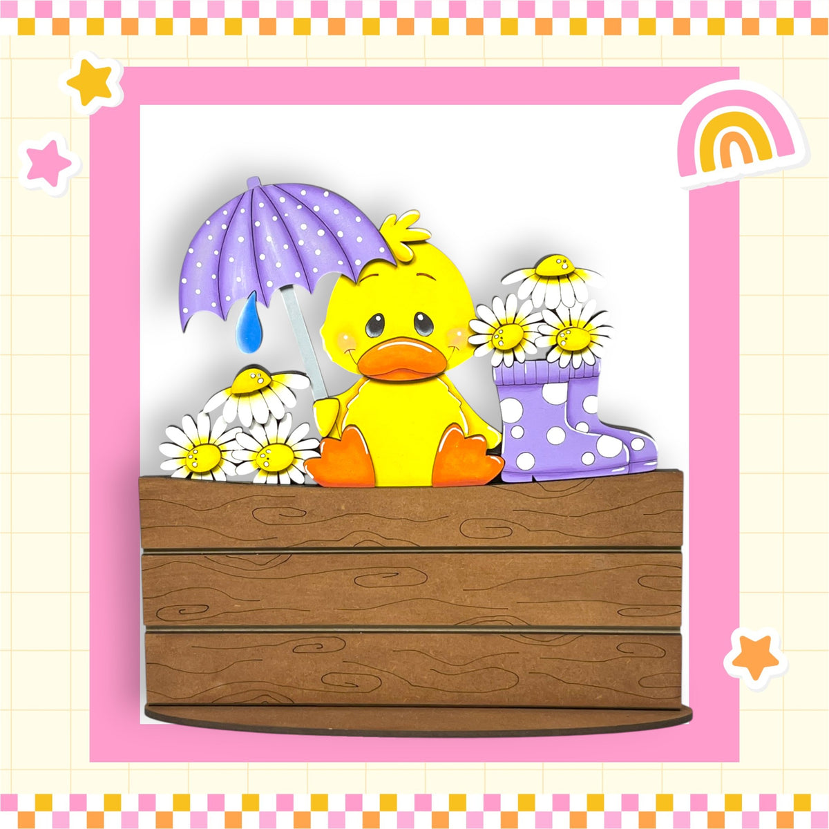 A yellow duck holding a purple umbrella and surrounded by white daisies and purple polka dot boots, sitting on a wooden bench.