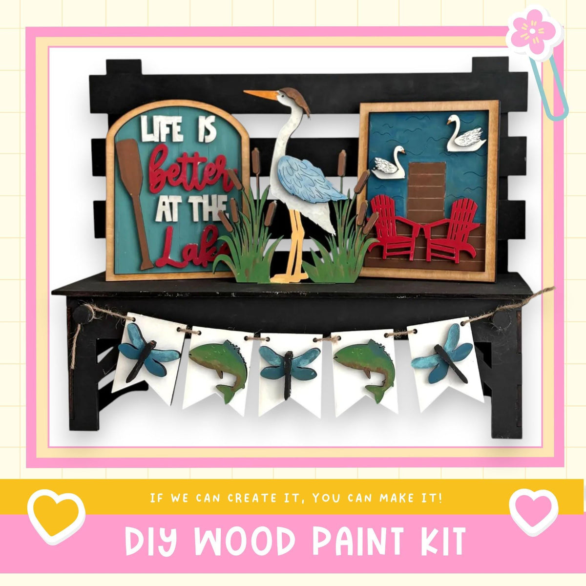 The image is a DIY wood paint kit featuring a wooden bench with a bird, a sign that says "Life is better at the lake", and a banner with various wooden and paper elements.