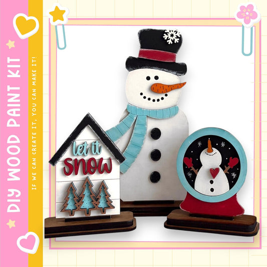 A snowman and a snow globe are displayed in the image, along with a sign that says "let it snow".
