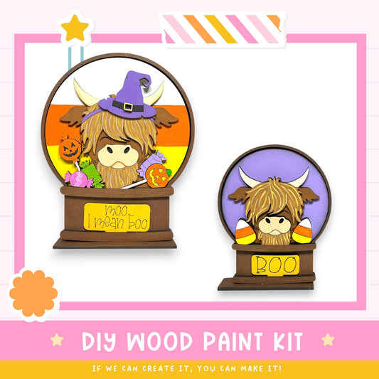 two wooden paint kits, each depicting a cartoon character with a witch hat and a purple hat. The kits are labeled as "DIY WOOD PAINT KIT" and "IF WE CAN CREATE IT, YOU CAN MAKE IT!"