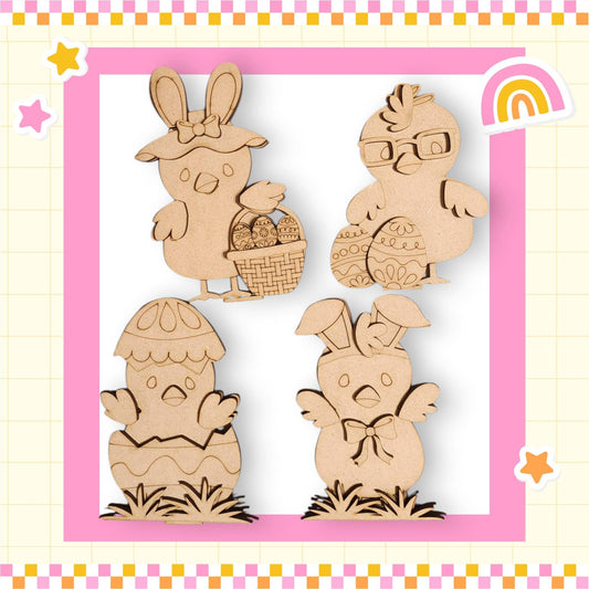 a wooden cutout of easter bunnies with a rainbow in the background