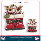 A festive illustration featuring two reindeer in Santa's boots, with a "Reindeer Cheer" sign attached to the boots. The boots are decorated with candy canes and snowflakes, creating a cheerful holiday scene.