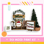 a wooden santa sign sitting on top of a shelf