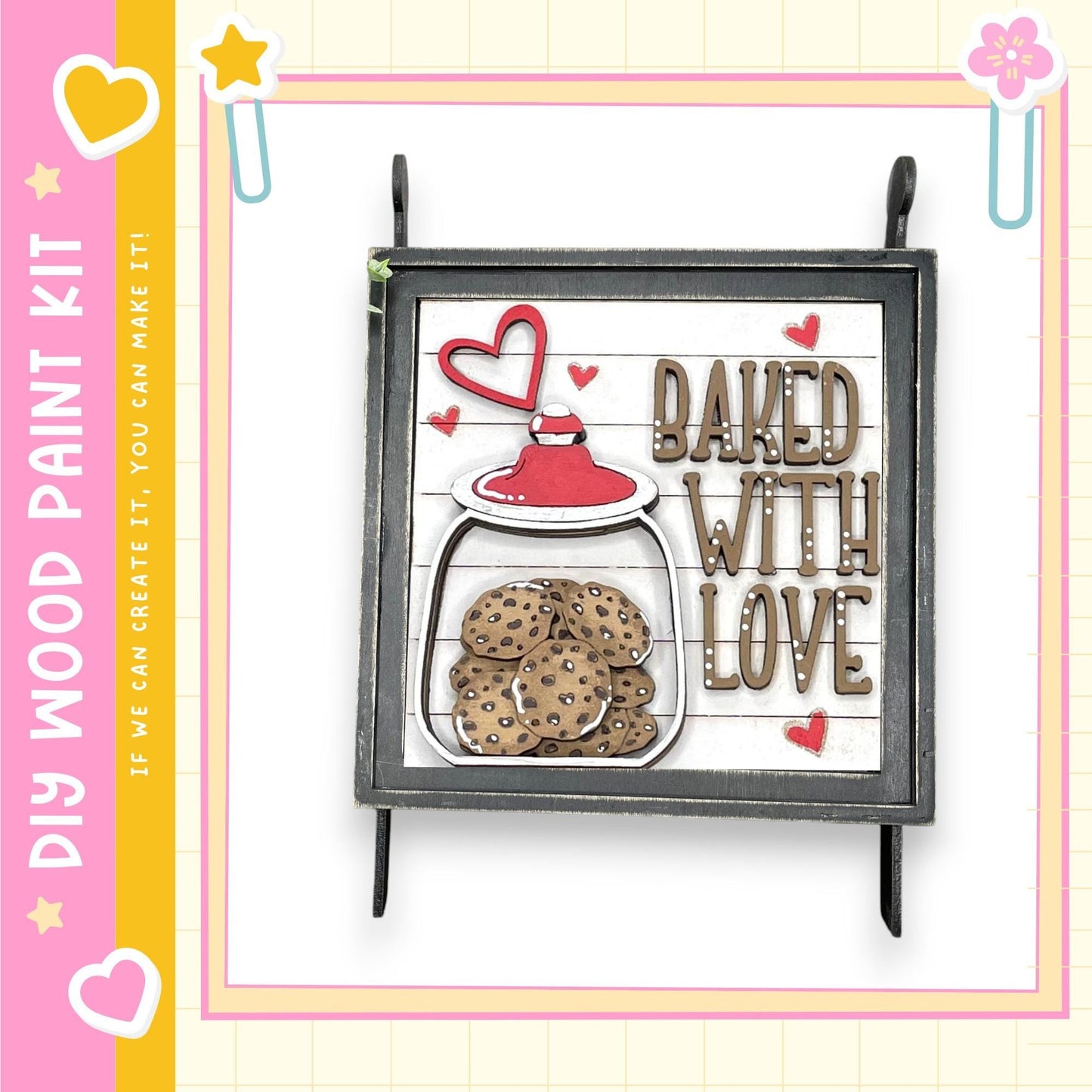 a wooden sign with a heart-shaped cookie jar and the text "BAKED WITH LOVE" written on it.