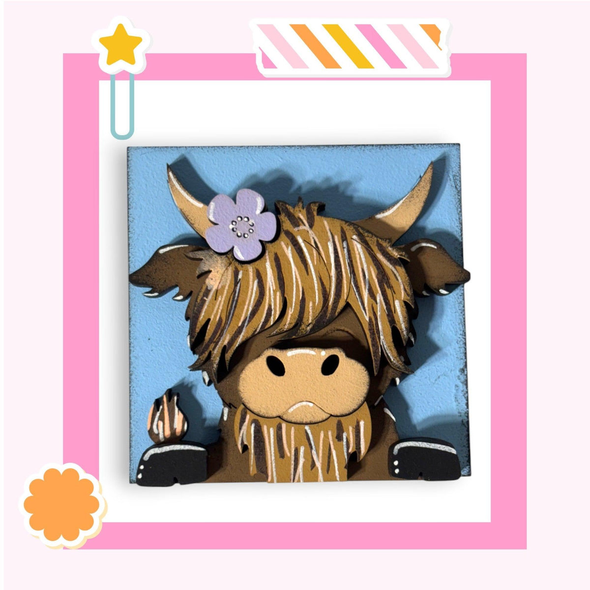 a picture of a cow with a flower in its hair