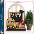 a DIY kit with a school bus, a chalkboard, a potted plant, and a pencil, all arranged on a shelf.
