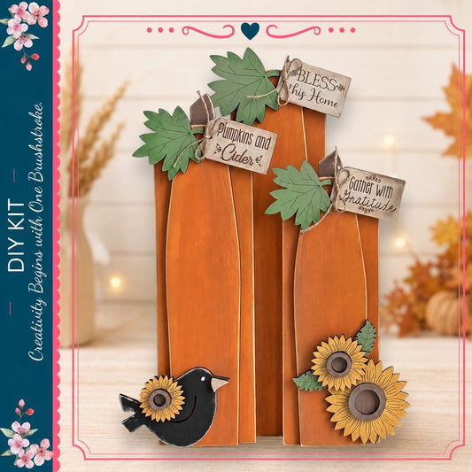 a DIY kit with a pumpkin and sunflower decoration, along with a bird and leaves. The kit appears to be a creative project, possibly for fall decor.