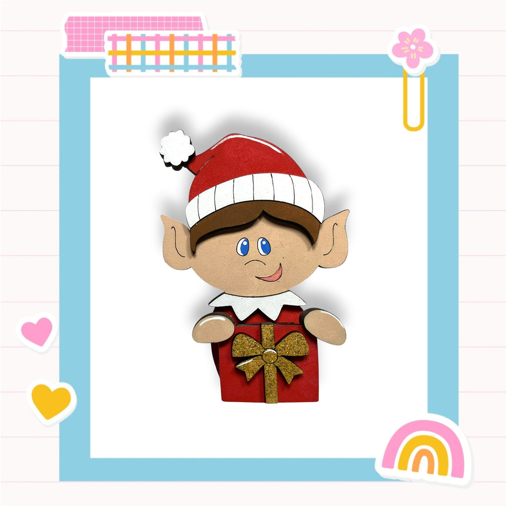 A cheerful cartoon elf wearing a Santa hat and holding a gift box, surrounded by colorful stickers and a rainbow-colored background.