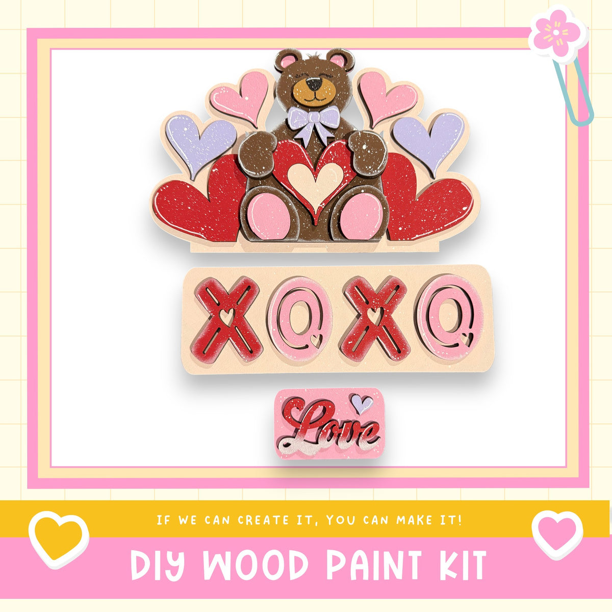 The image is a colorful and playful DIY wood paint kit featuring a teddy bear surrounded by hearts and the text "XOXO" in a playful font.