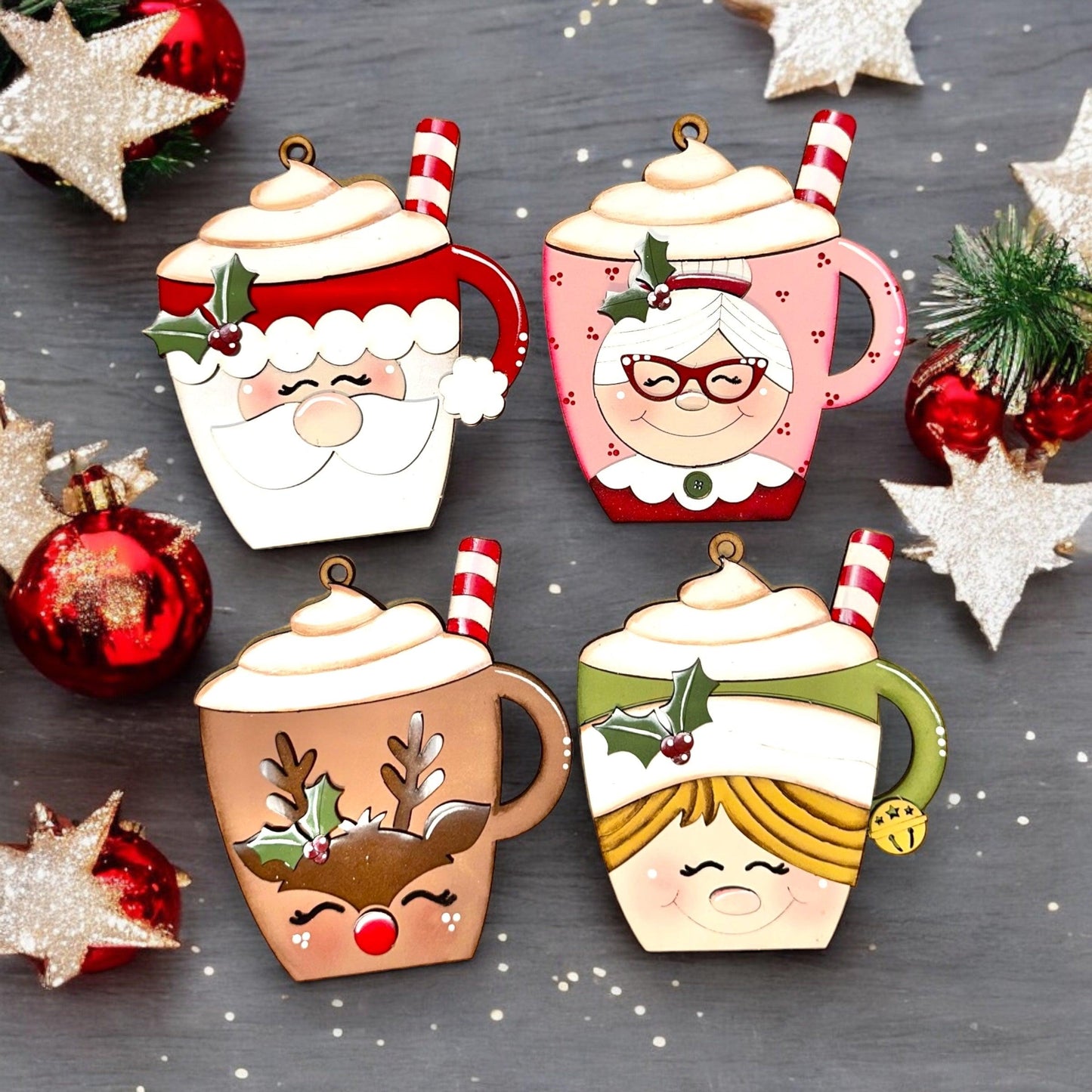 a group of christmas tea cups sitting on top of a table