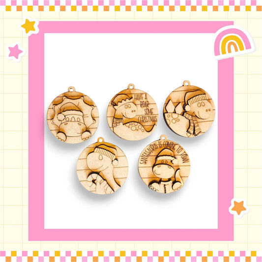 five wooden ornaments with various designs, including a cat, a dog, and a bird, all set against a pink and yellow checkered background.