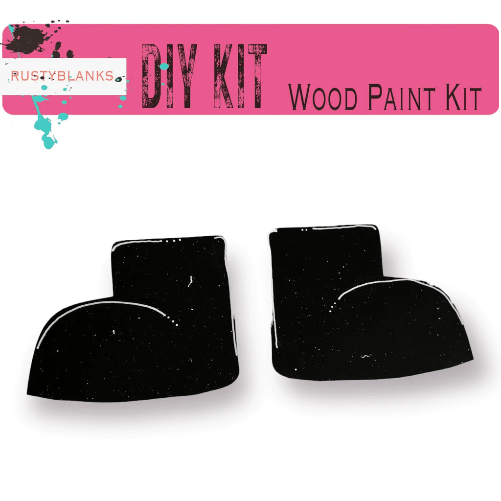 a pair of black wood paint sitting on top of a white surface