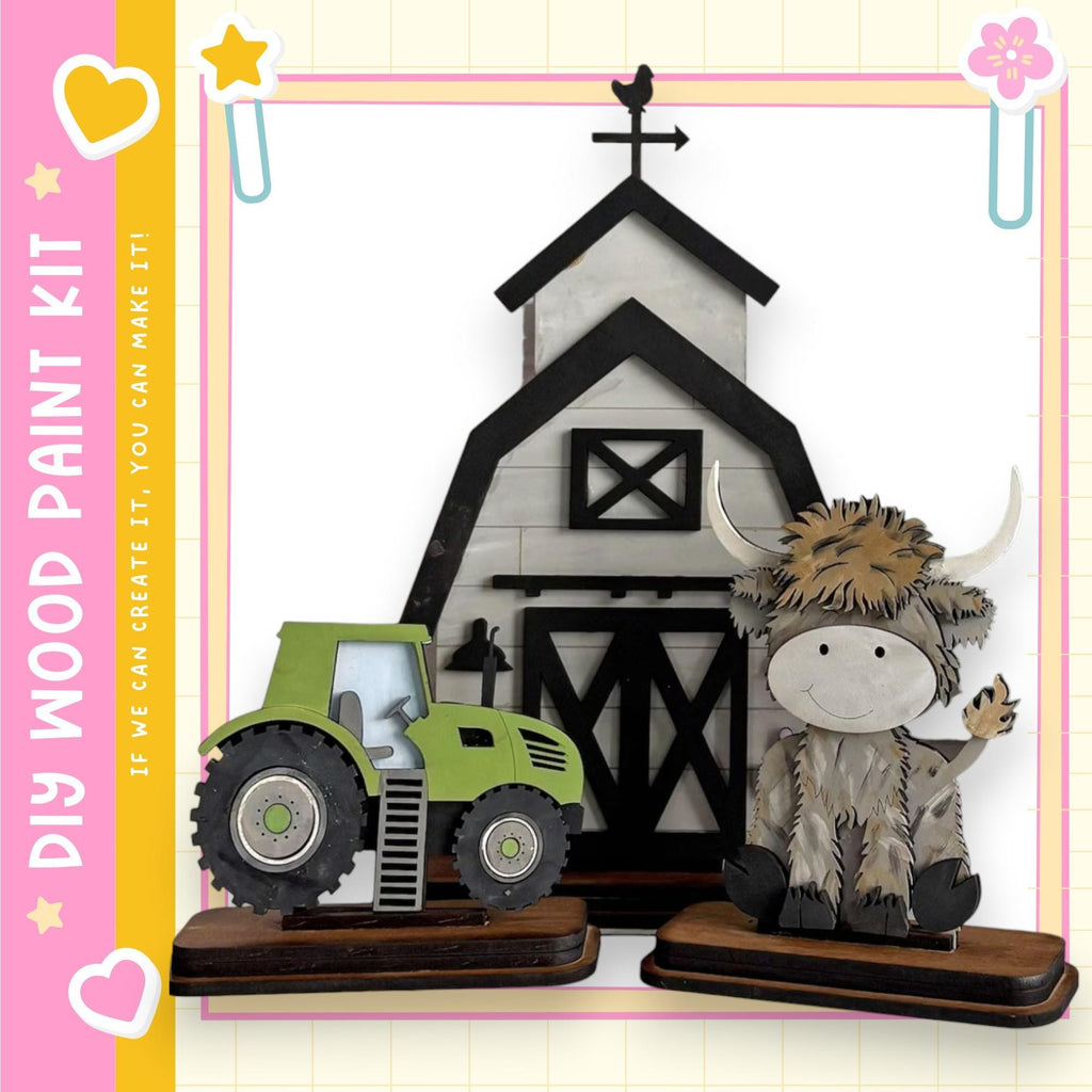 a wooden barn and a green tractor, with a cow figurine sitting next to the tractor.