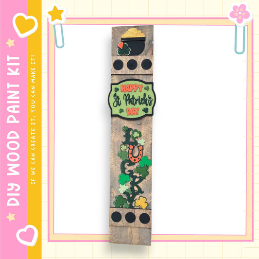 a wooden stick with a picture of a plant on it