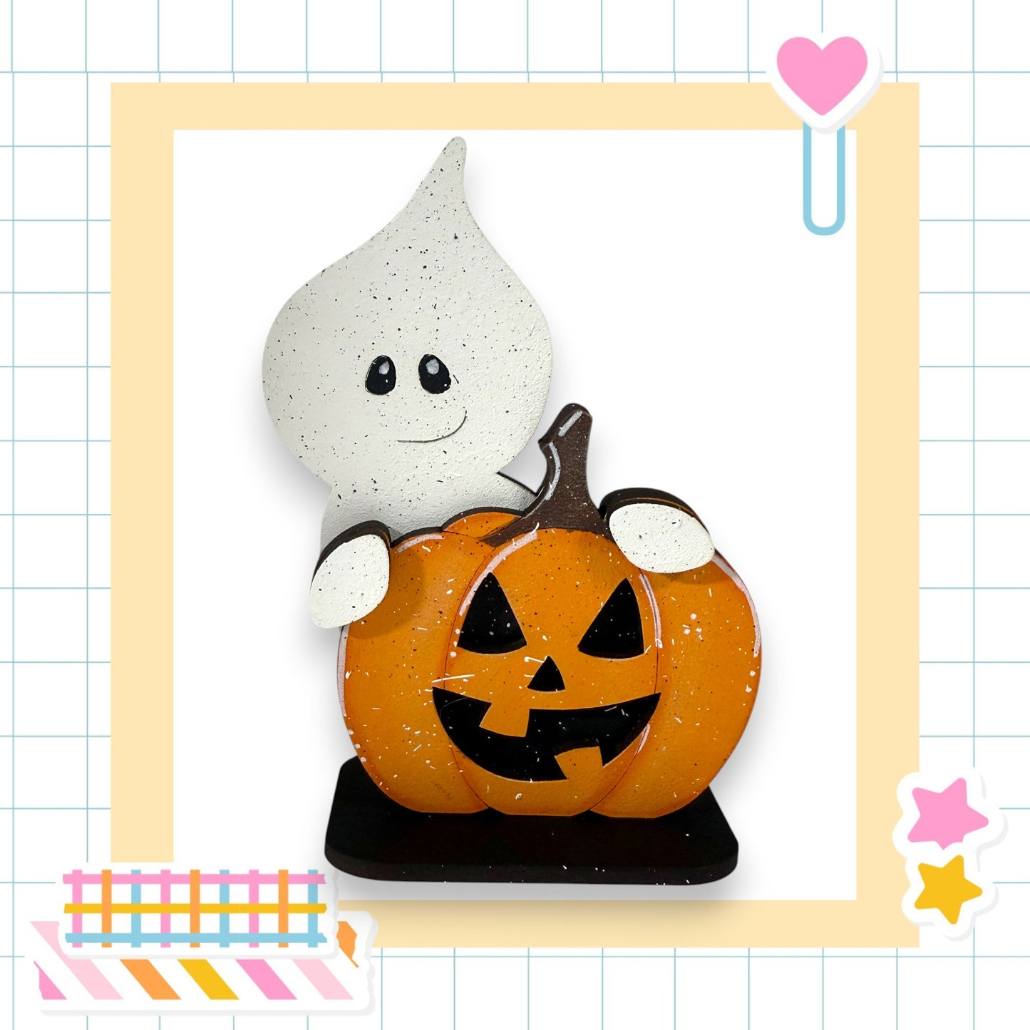 A Halloween-themed decoration featuring a ghost and a carved pumpkin.