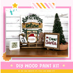 a picture of a wooden santa sign and other christmas decorations
