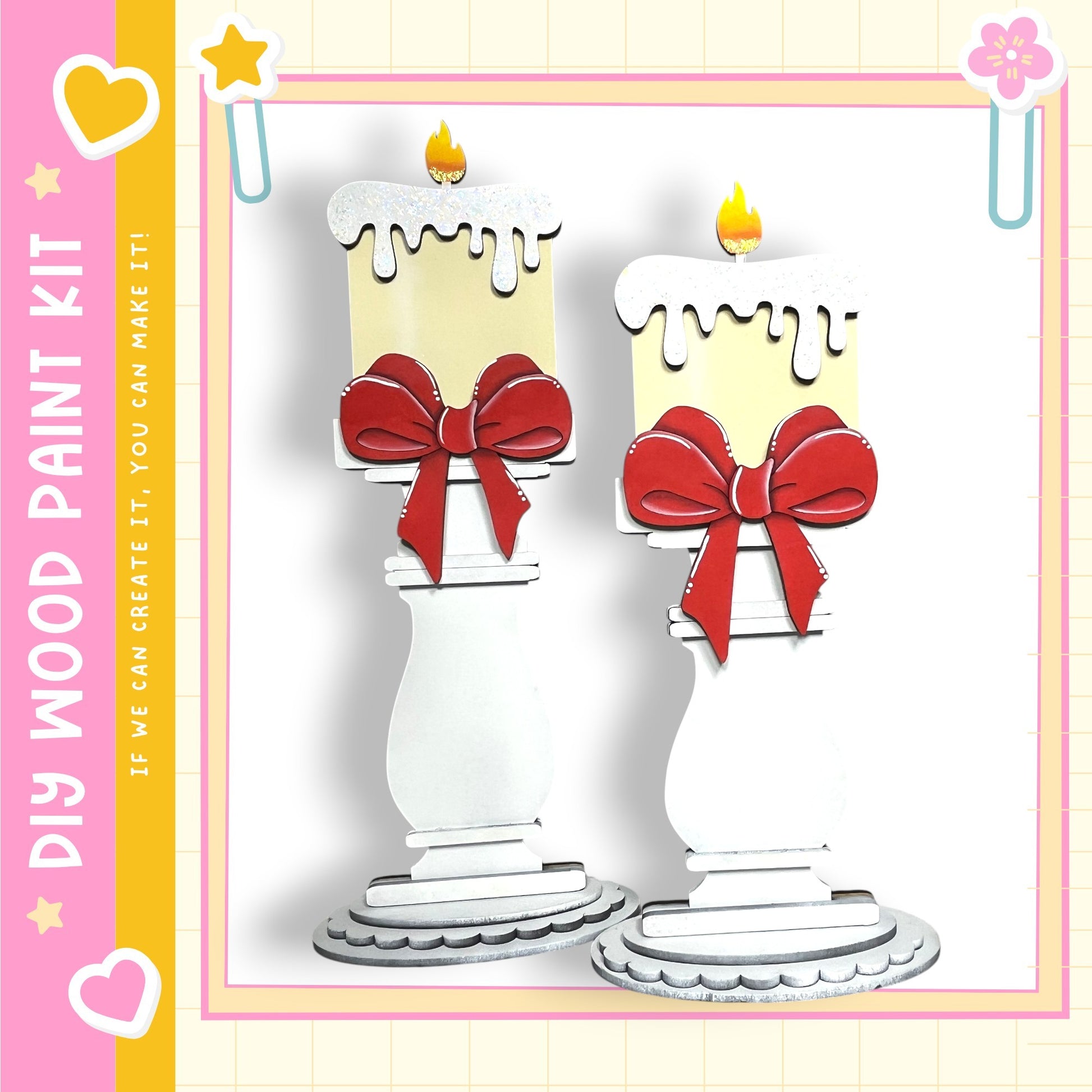 two white candle-like objects with red bows, standing on a white base.