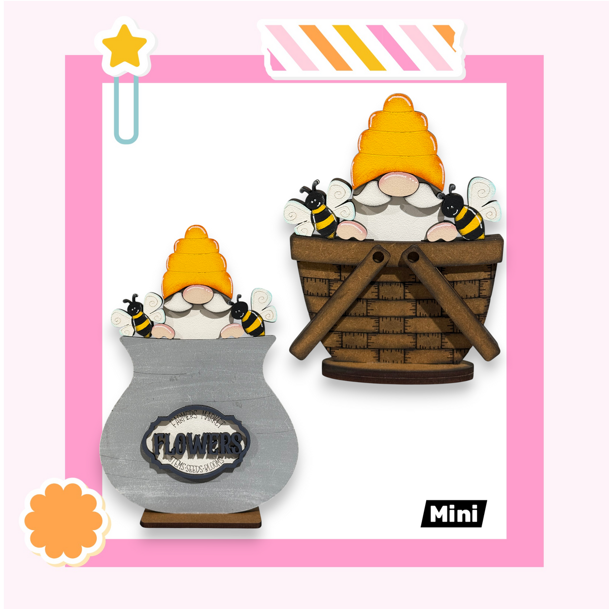 two gnomes sitting in a basket, with flowers on the side of the basket.