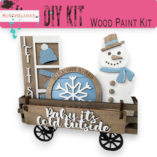 a wooden craft kit with a snowman in a wagon