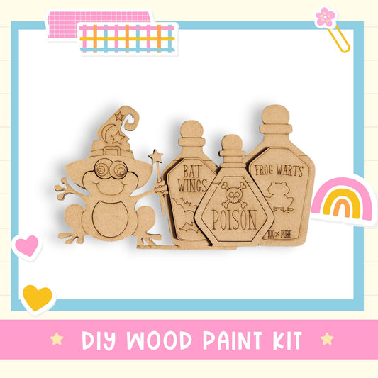 The image is a DIY wood paint kit featuring a wooden frog character and three wooden bottles with labels.