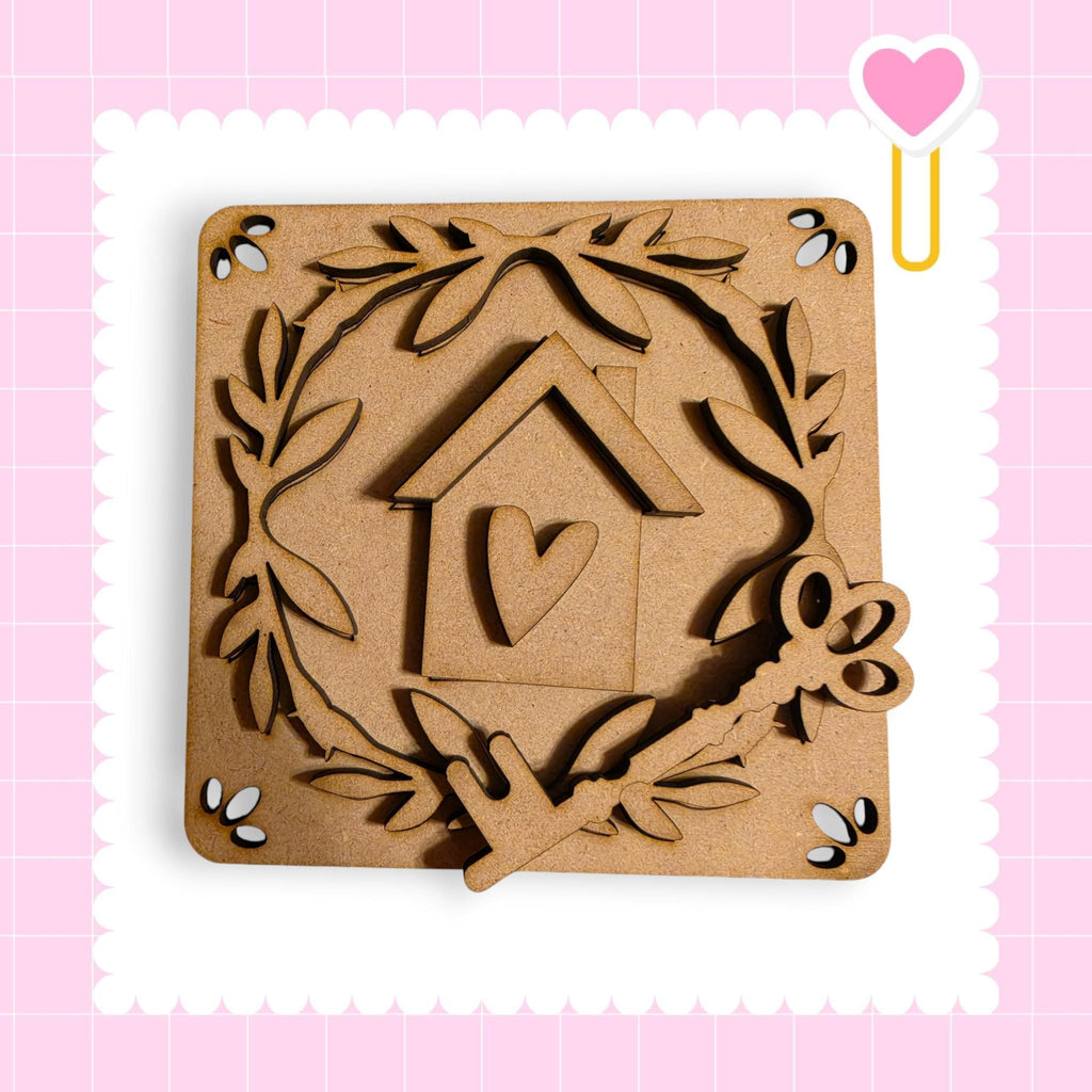 a wooden house key and a heart-shaped cutout, all set against a pink background with a scalloped edge.