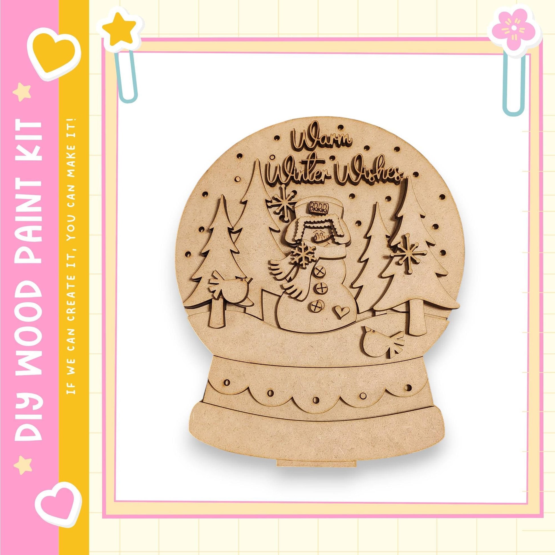 A wooden snow globe with a snowman and trees, along with the text "Warm Winter Wishes" written on it.