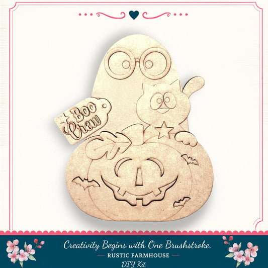 a Halloween-themed DIY kit, including a carved pumpkin, a cat, and a ghost. The kit is designed to spark creativity and is available at Rustic Farmhouse.