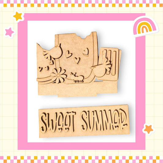 a wooden stamp with a picture of a mouse