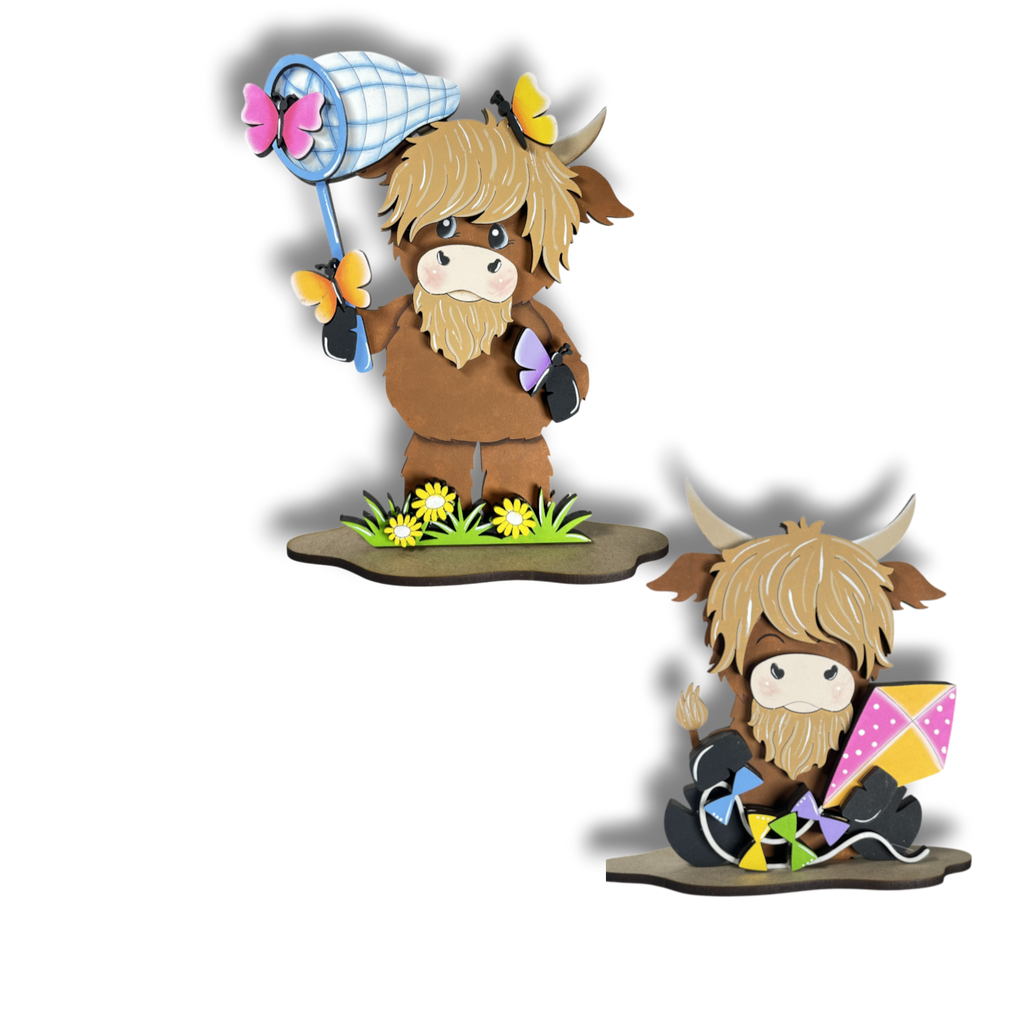 two cartoon cows, one standing and one sitting, each holding a different object. The cow standing is holding a butterfly net, while the cow sitting has a kite.