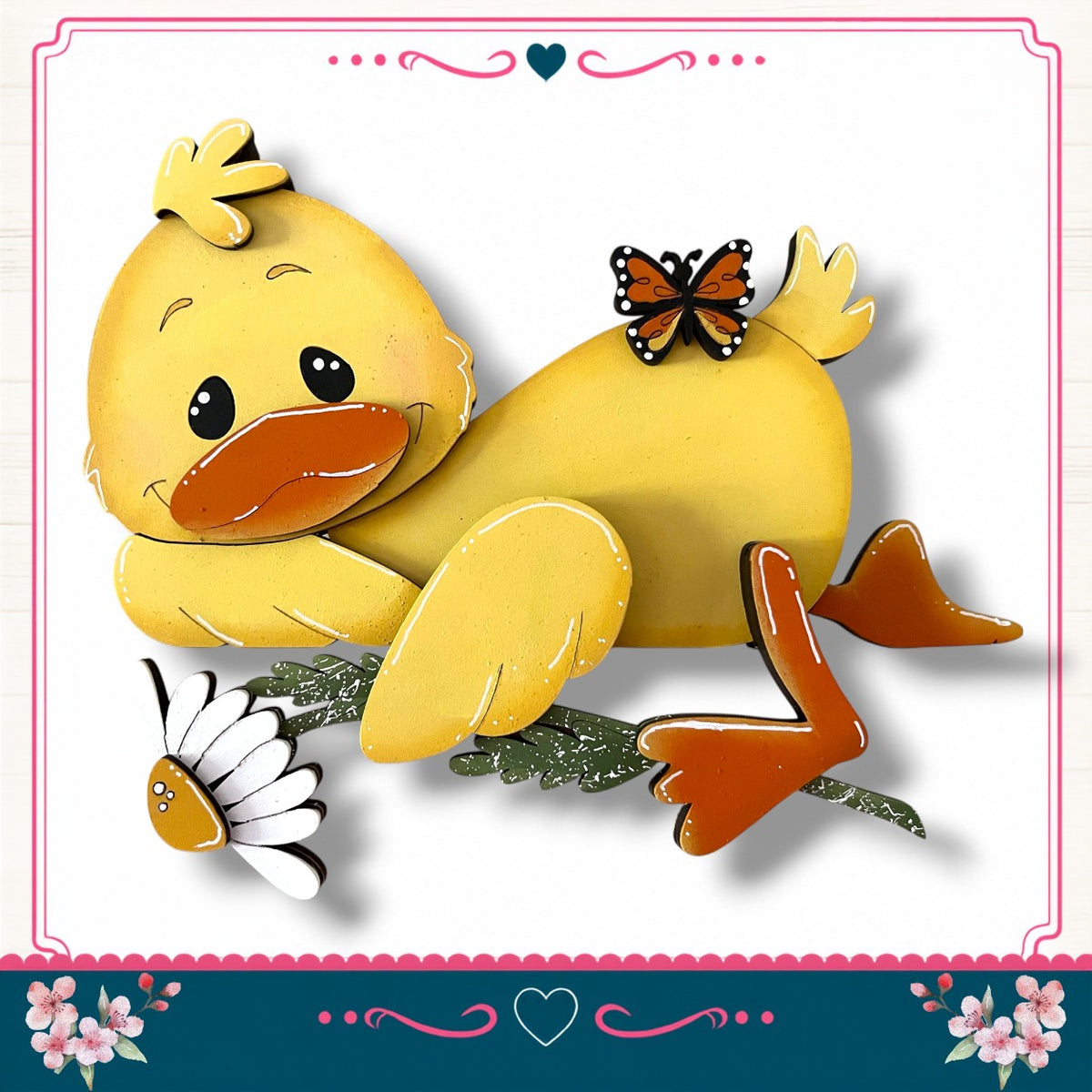 A yellow duck with a flower on its back and a butterfly on its back is depicted in the image.