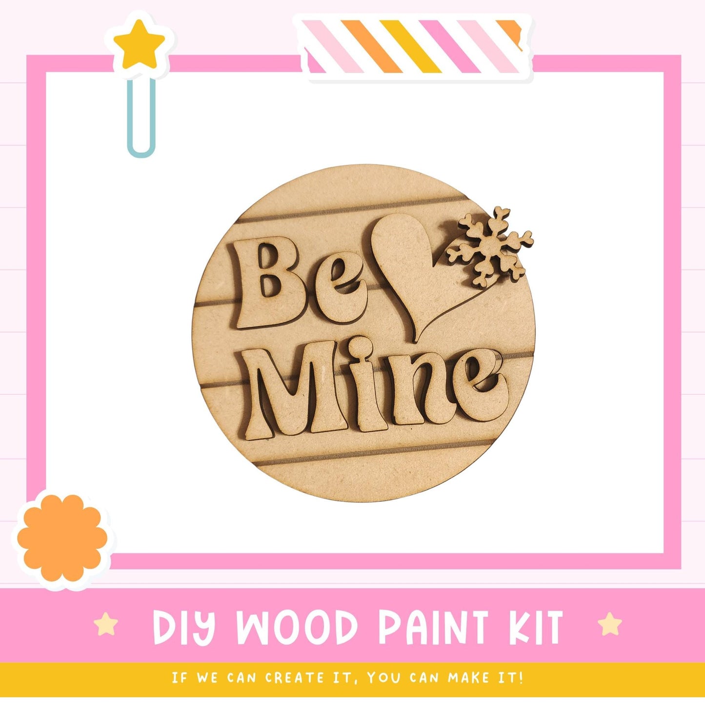 The image is a promotional poster for a DIY wood paint kit, featuring a wooden sign with the words "Be Mine" and a snowflake decoration.