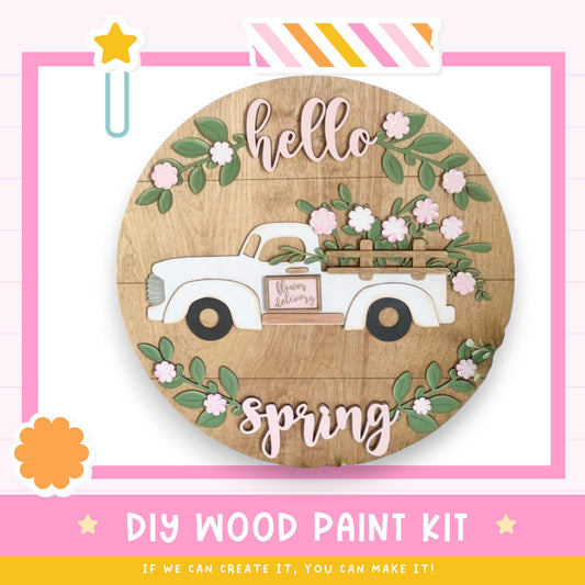 a wooden sign with a truck painted on it