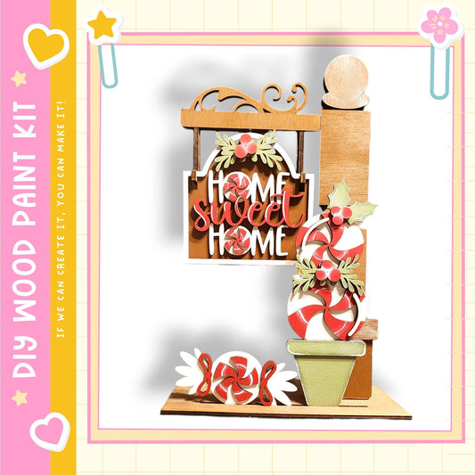 The image is a colorful and festive display featuring a wooden sign that says "Home Sweet Home", surrounded by various candy-like items such as candy canes, peppermints, and other sweets.