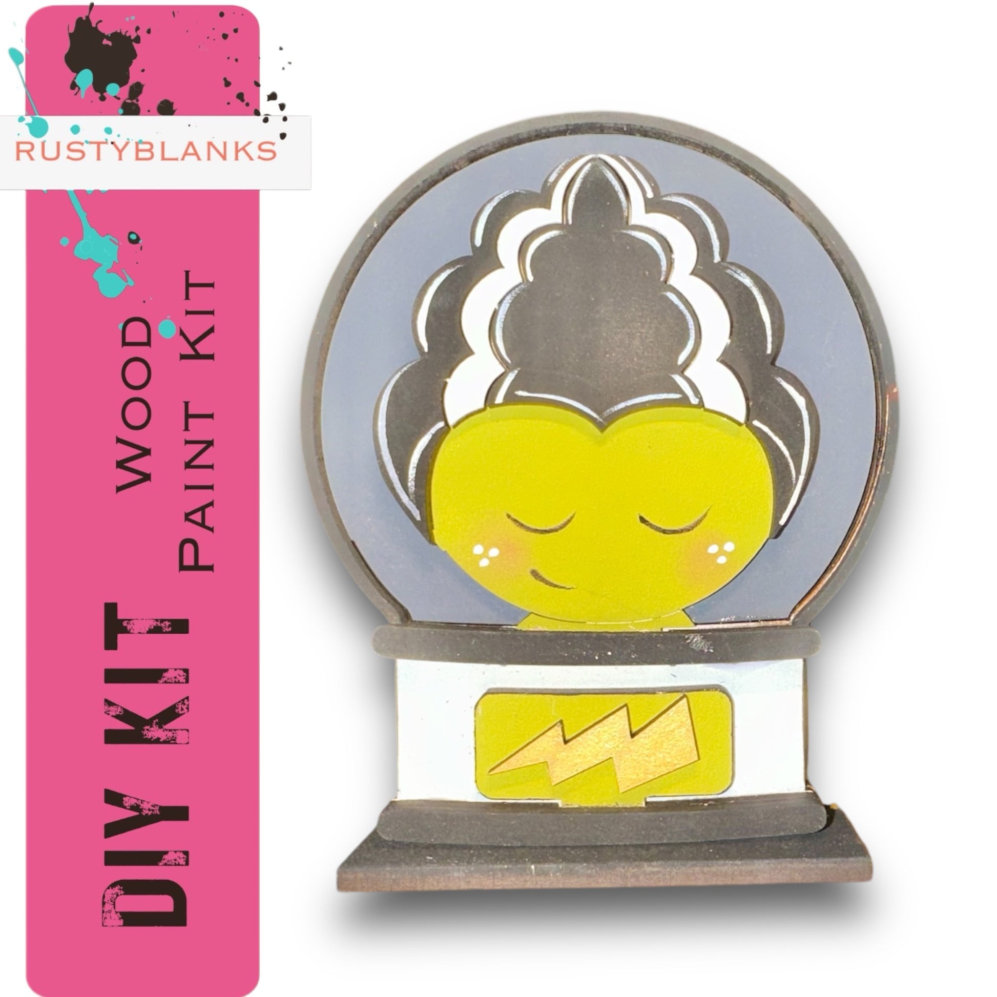 The image is a DIY kit featuring a wooden paint kit with a whimsical design, including a yellow heart-shaped object with a black and white striped pattern and a lightning bolt symbol.