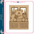 A wooden cutout of a bear holding a snowflake and a candy cane, with the text "Winter Wishes" below it.