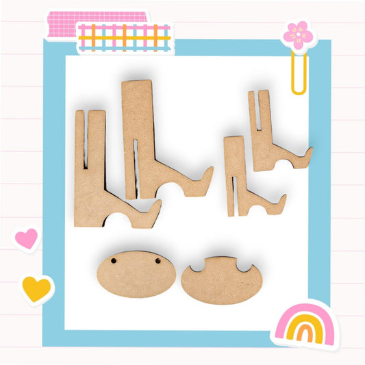 a cut out of wood with a rainbow in the background