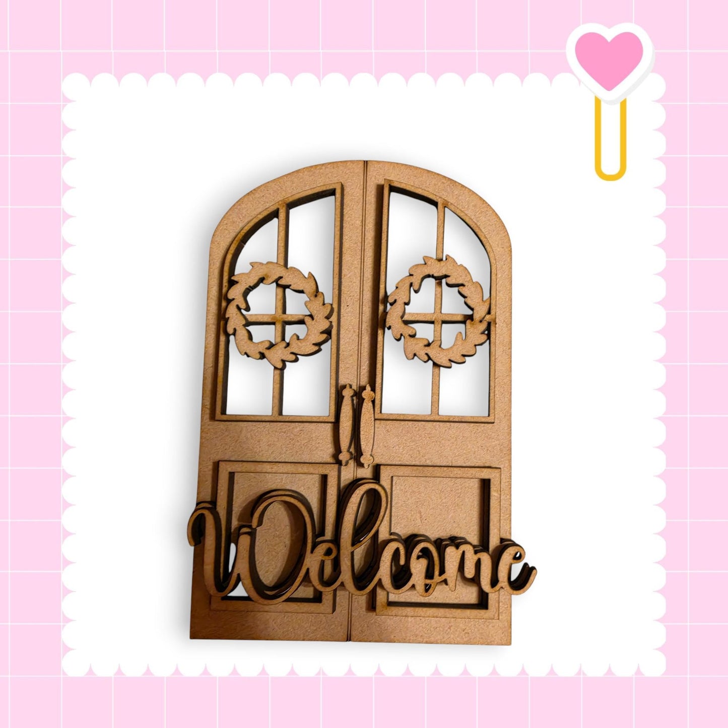 a wooden door with a wreath and the word "Welcome" written on it.