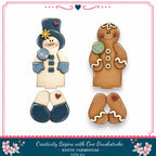 two gingerbread men, one wearing a snowman costume and the other a gingerbread man costume, both decorated with snow and joy signs.