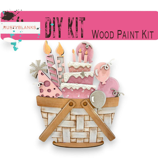 a wooden craft kit with a basket of cakes